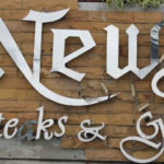 News steak and grill sign